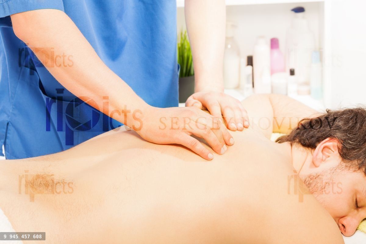 Young man relaxing in spa massage salon