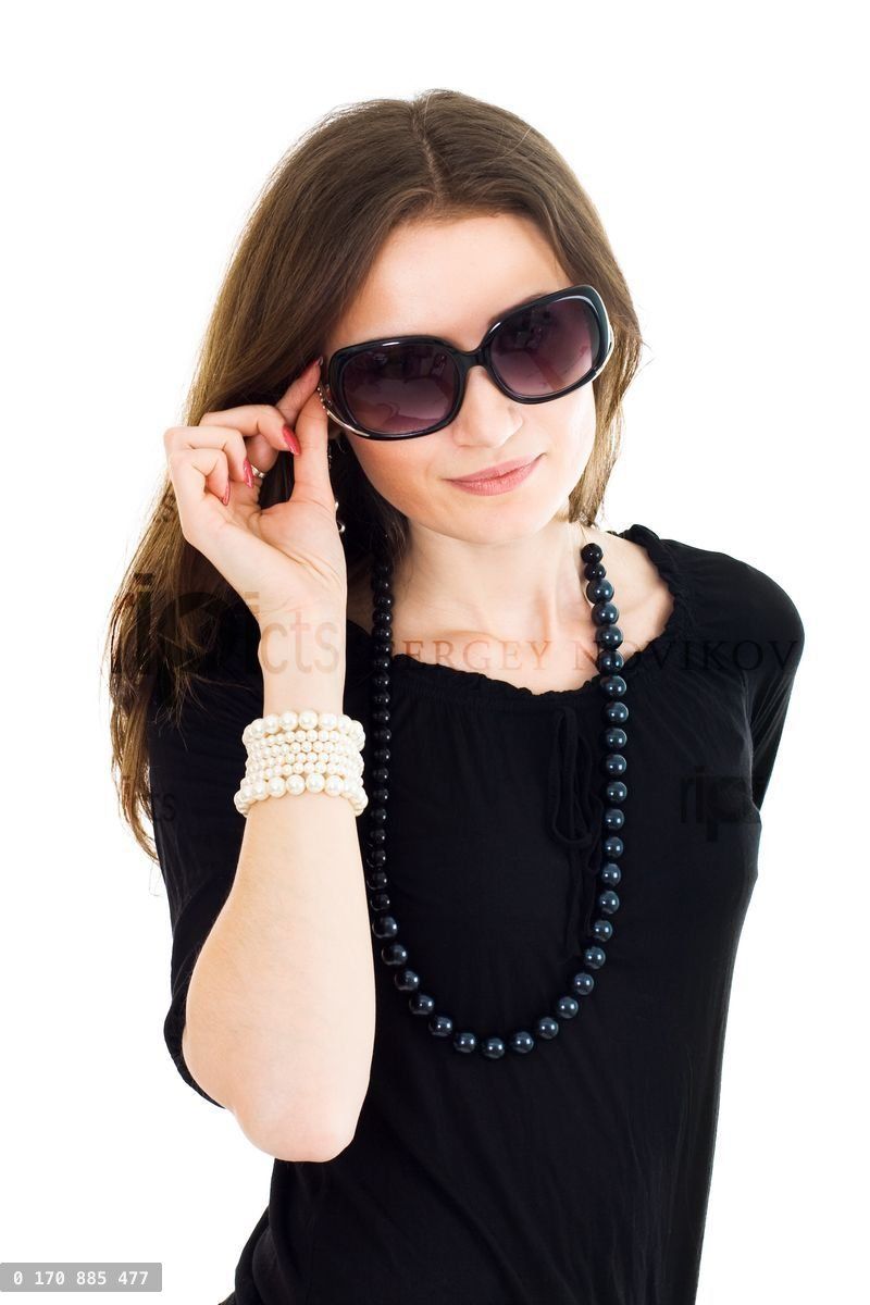 Woman in black dress and sunglasses