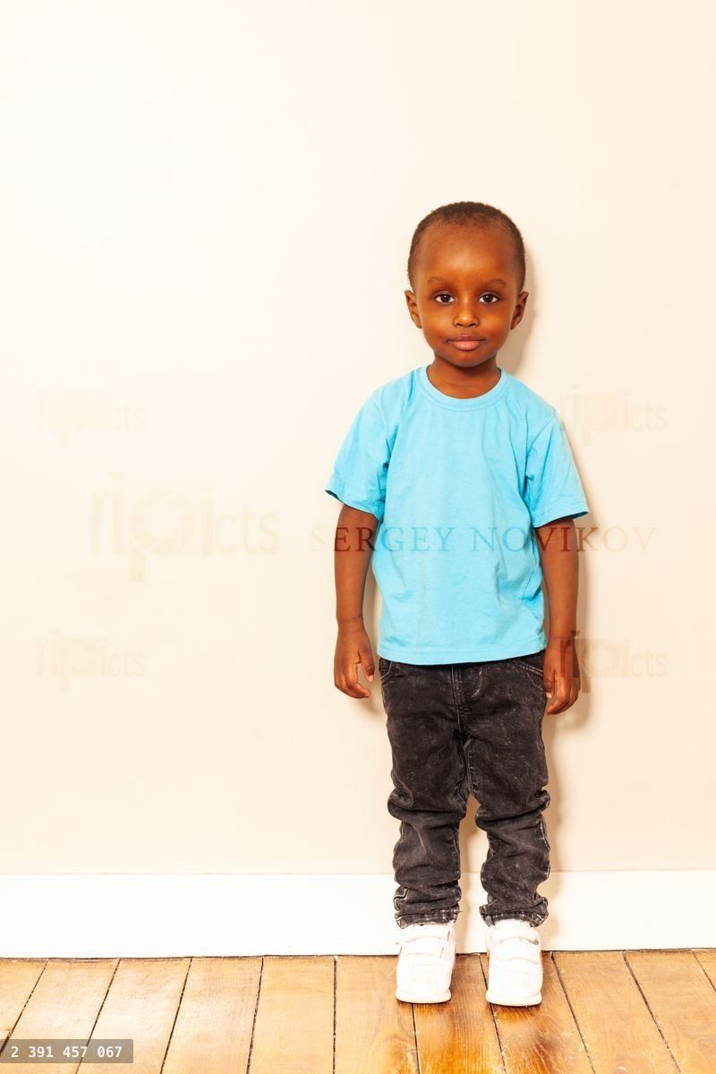 Full height portrait of little black boy smiling