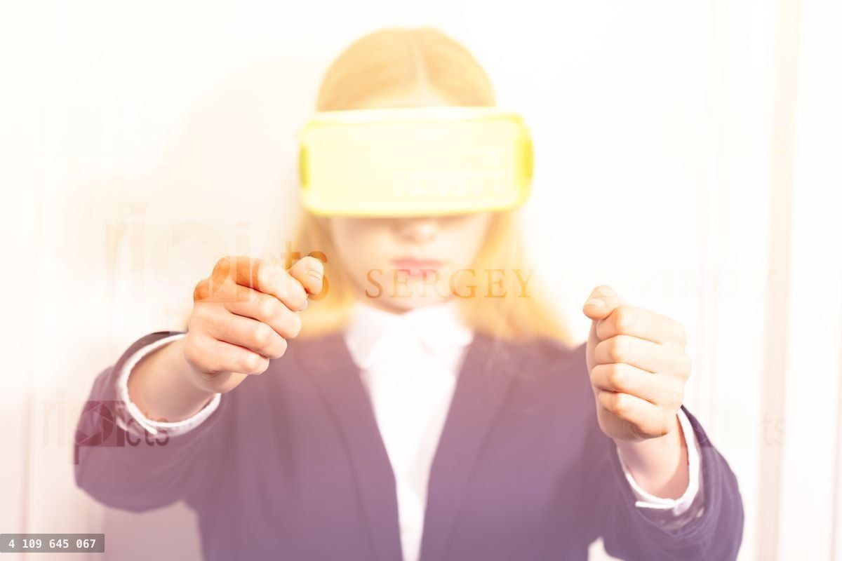 Woman in virtual reality device drive a video game