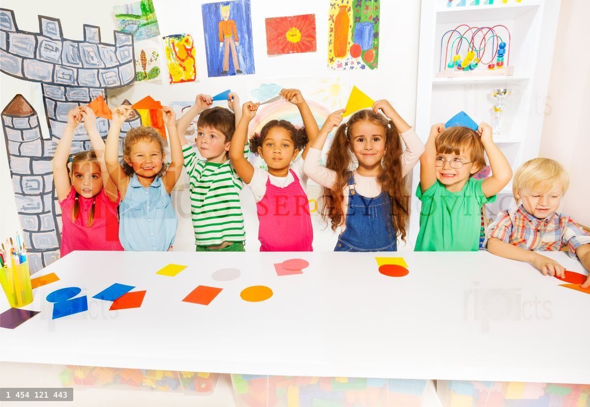 Happy boys and girls in the kindergarten art class