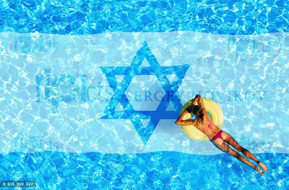 Woman swimming in the pool with Israel flag below
