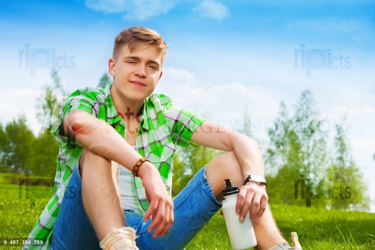 Young man resting on the grass