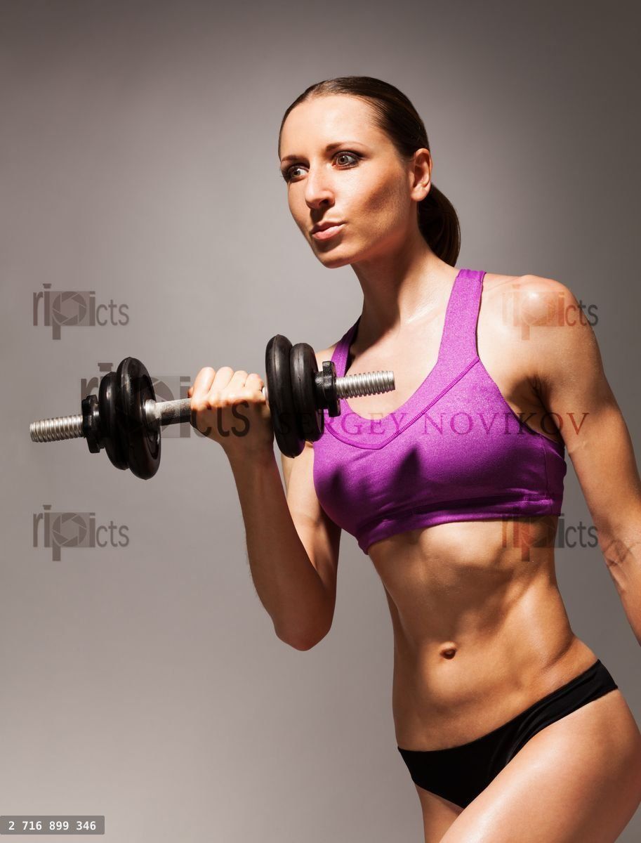 Young slim woman hold dumbbell with strong look