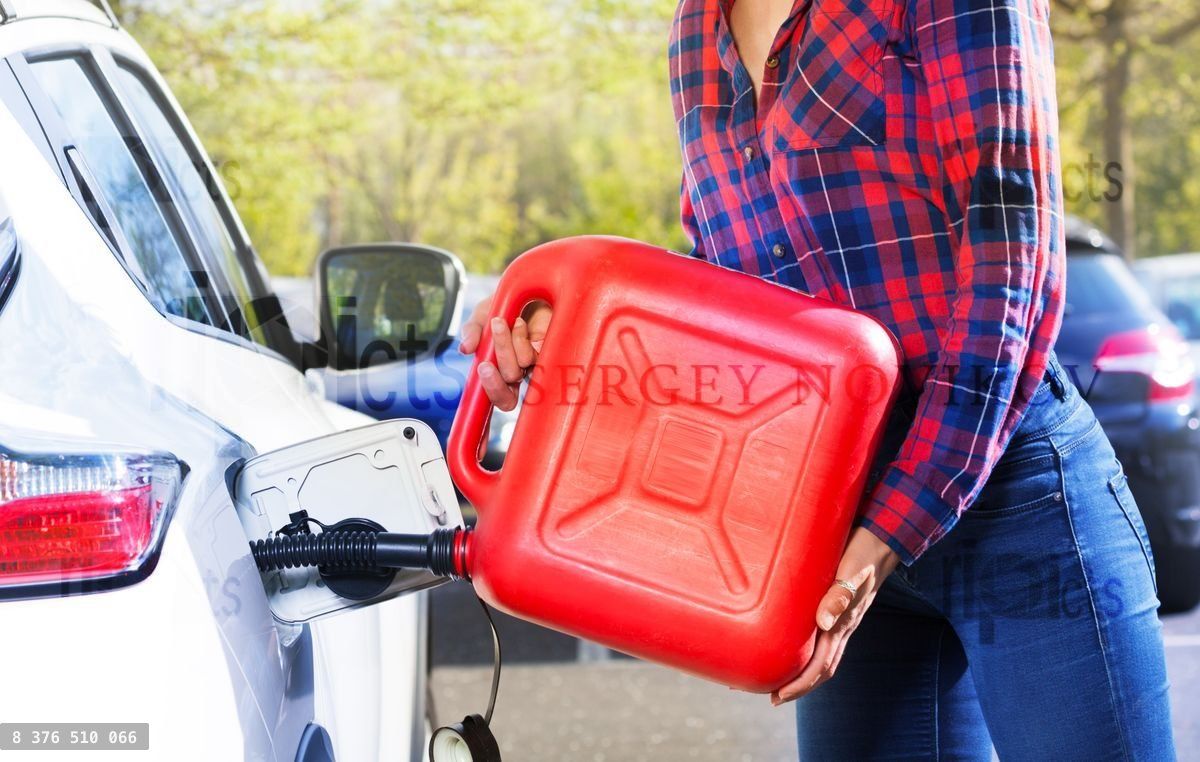 Woman with plastic canister filling car tank