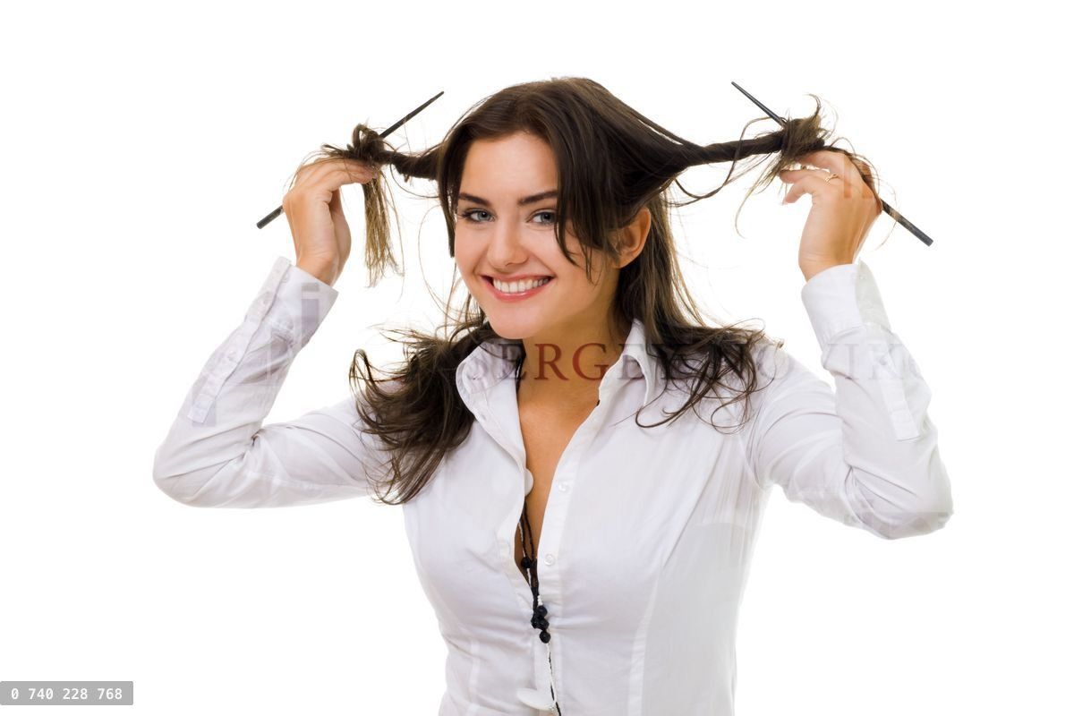 woman twirl her hair with sticks