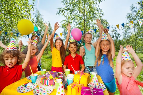 Big group of children at outdoor birthday party