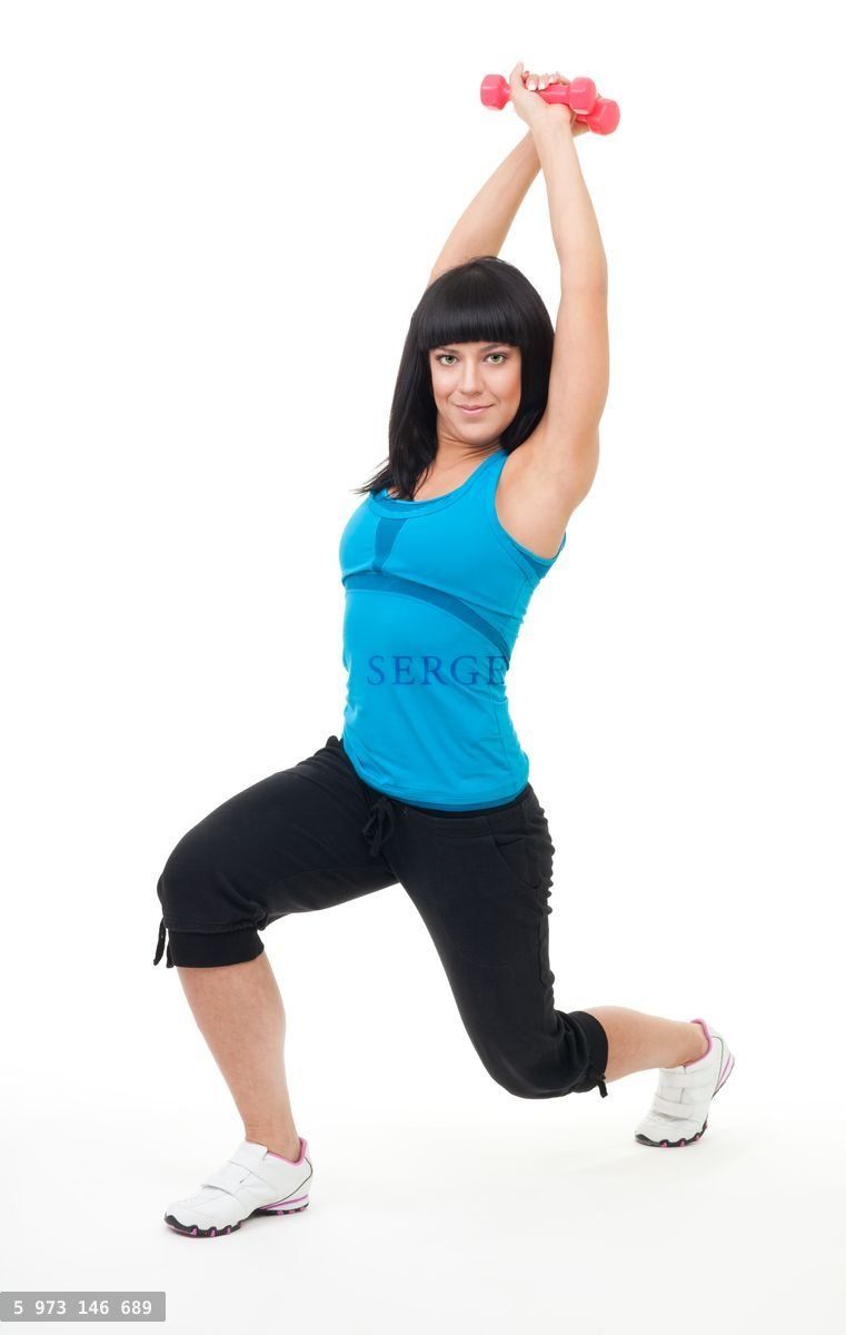Young positive woman exercise with dumbbells
