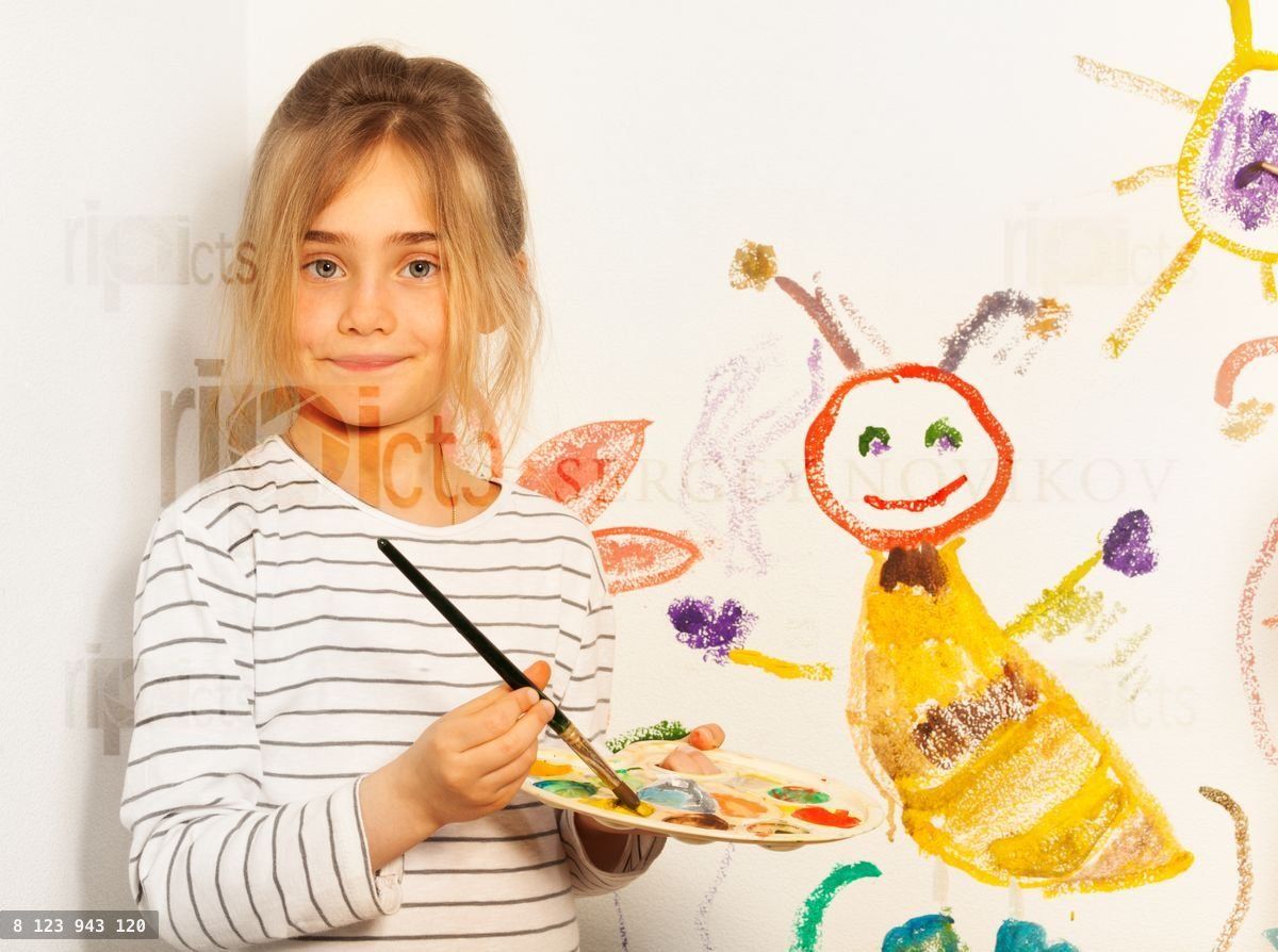 Young painter mixing colors on the pallet