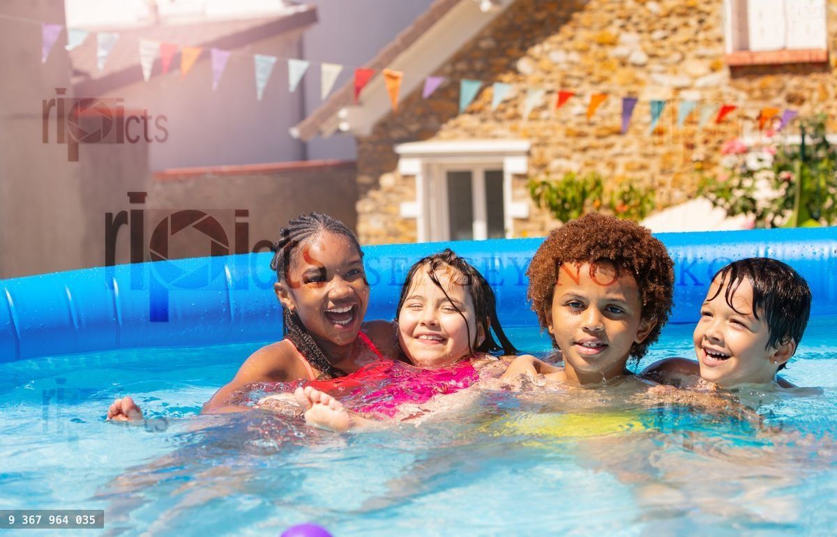 Four happy boys, girls hug sit smile in swim pool