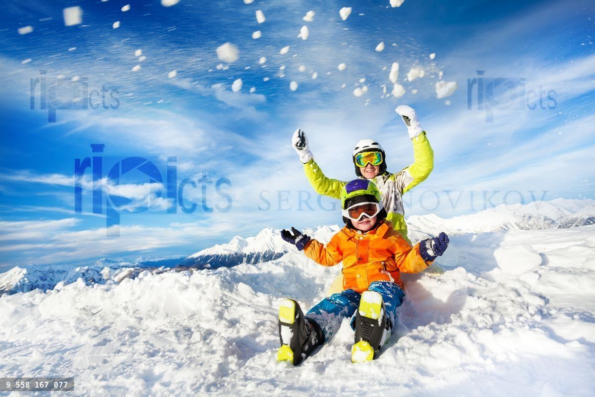 Mother and son on the mountain happy throw snow