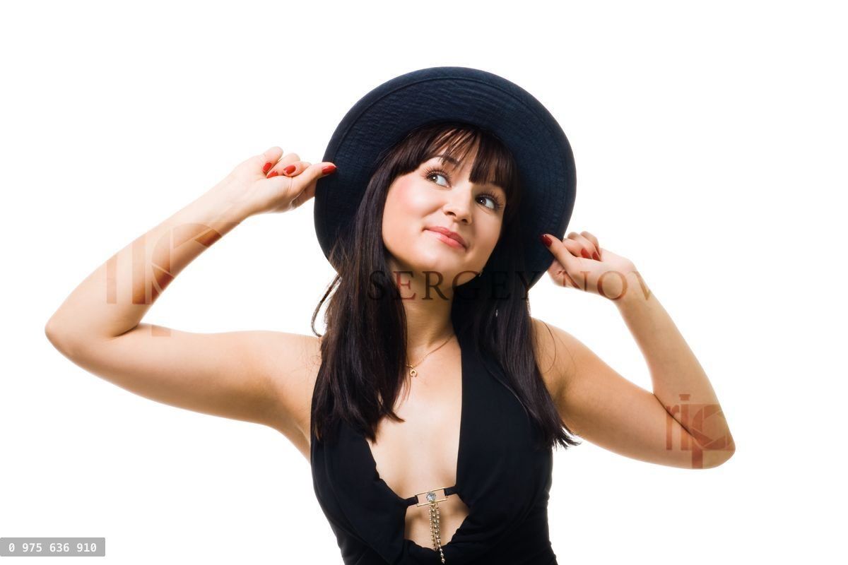 Young friendly woman smile and hold big hat