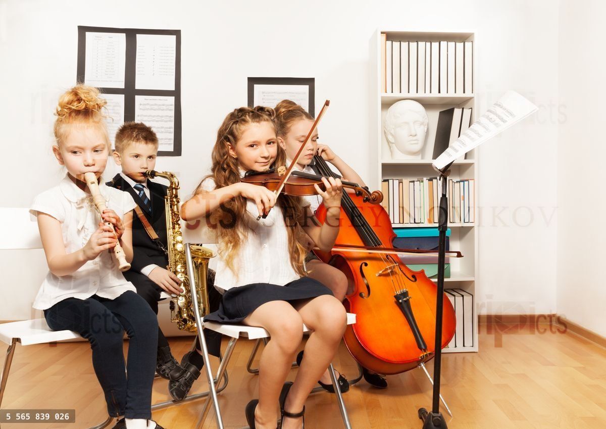 Cheerful children playing musical instruments