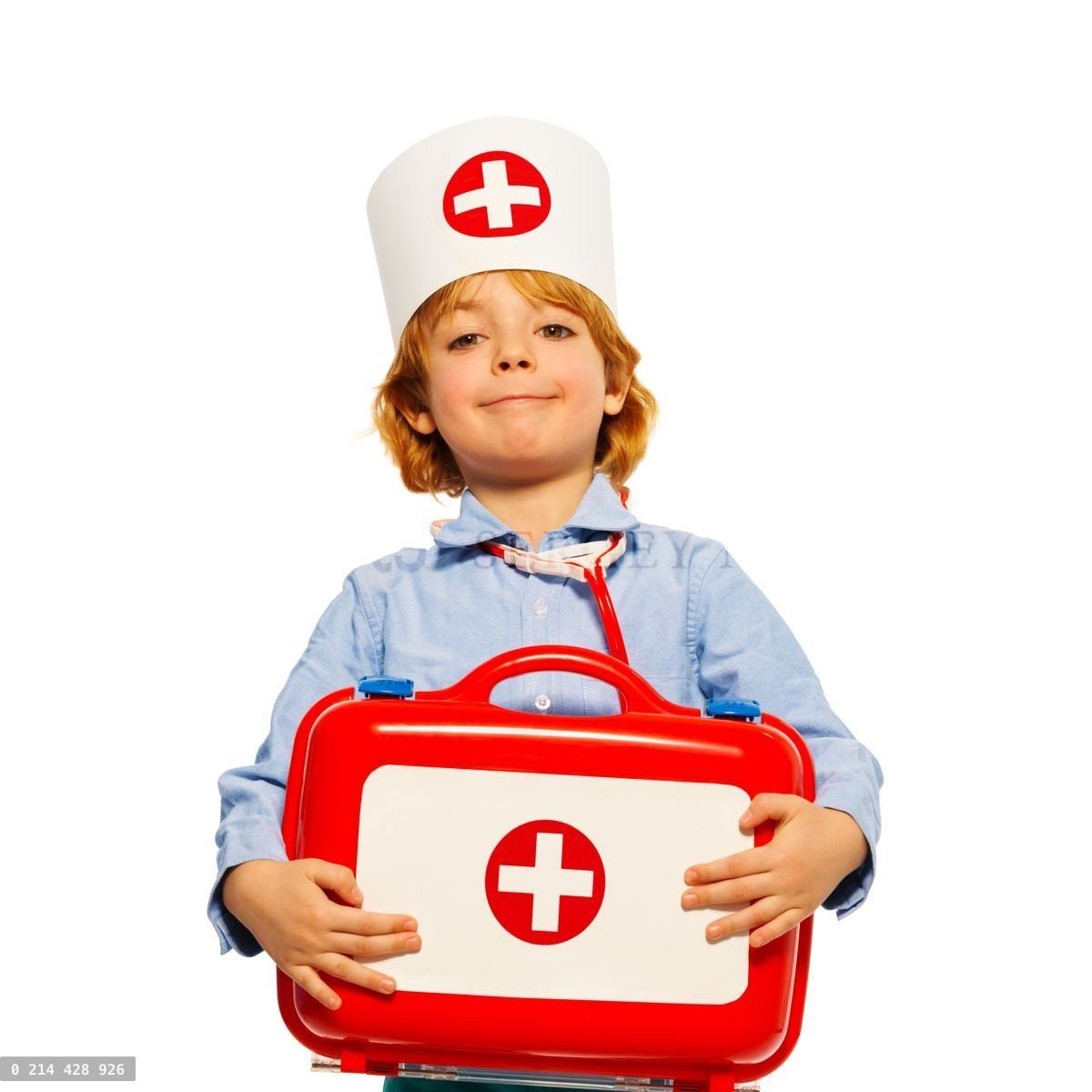 Young boy with medical cap and toy first aid kit