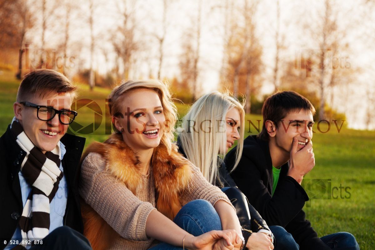 Four students having fun in the park