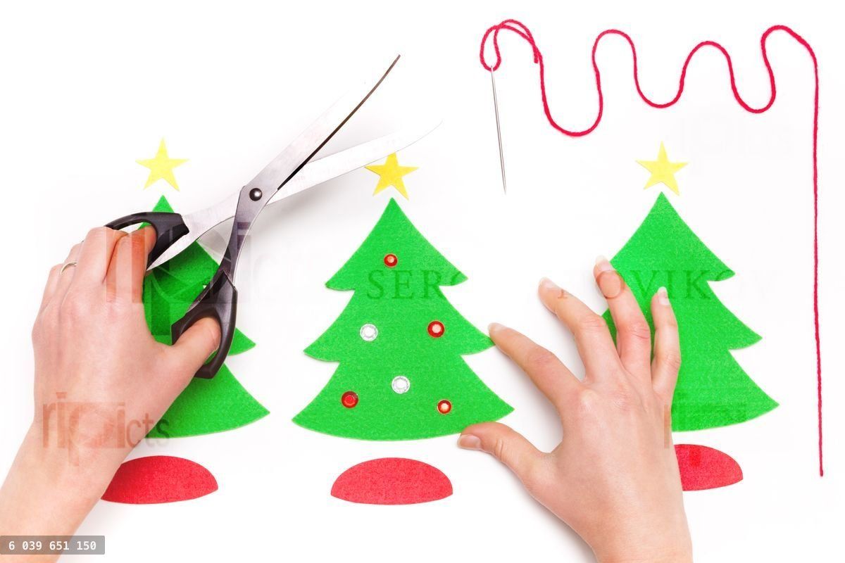 Woman using scissors and making Christmas cards