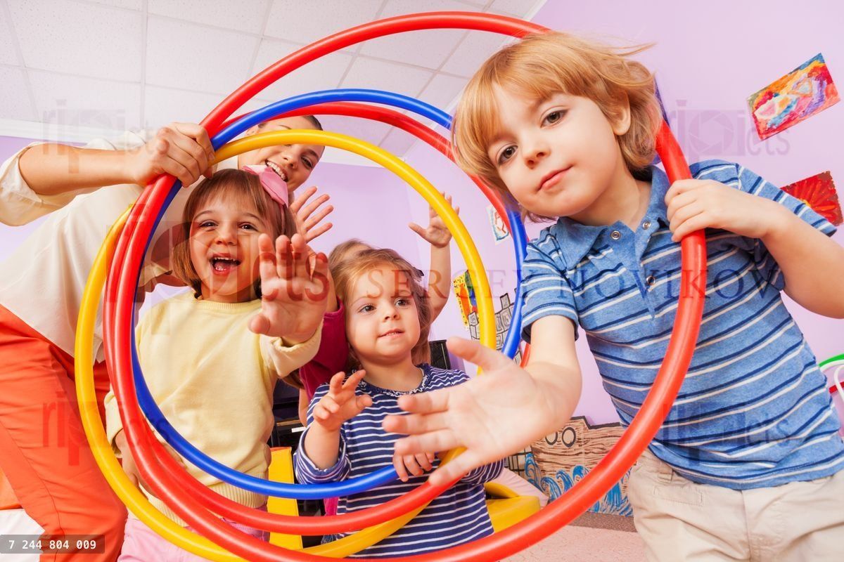 Fun in active class lesson boy and girls with hoop