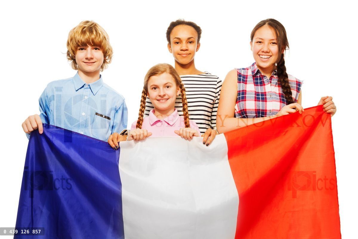 Four happy multiethnic students from France