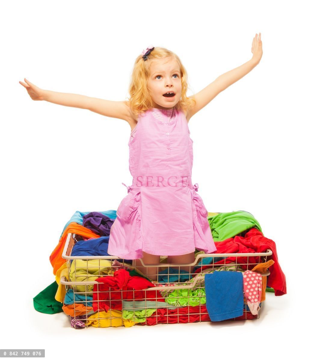 Happy blond girl with a lot of clothes