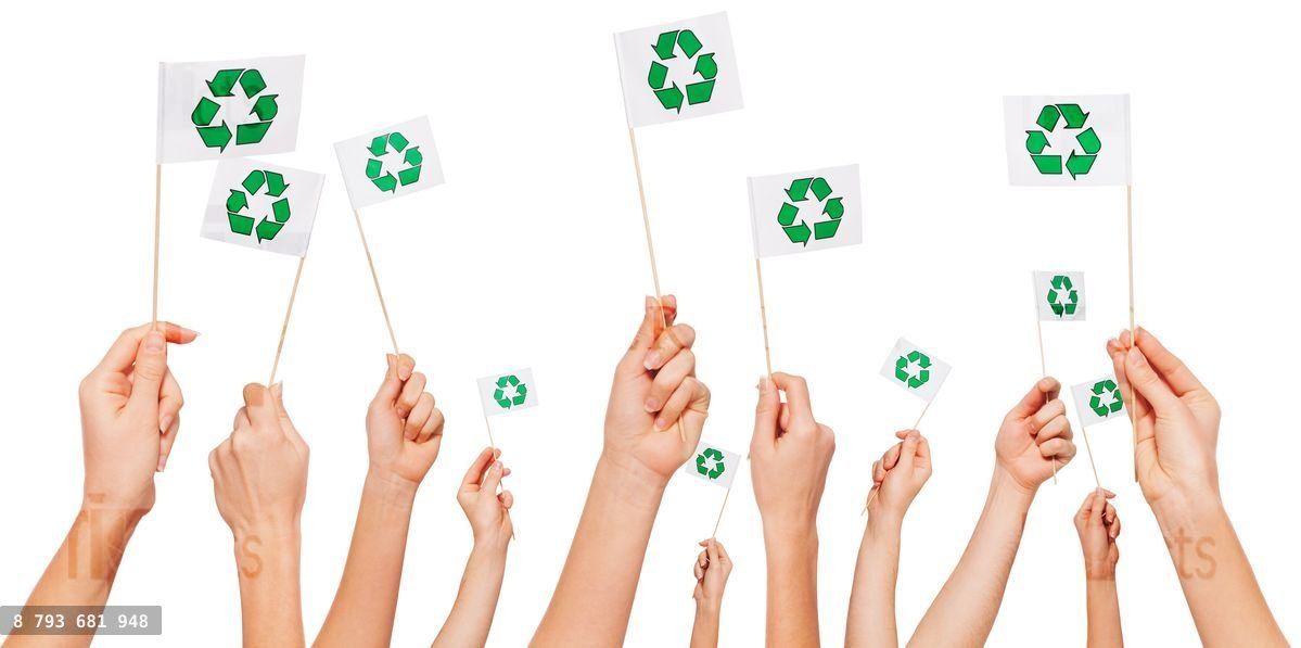Hands holding paper flags with recycle symbol