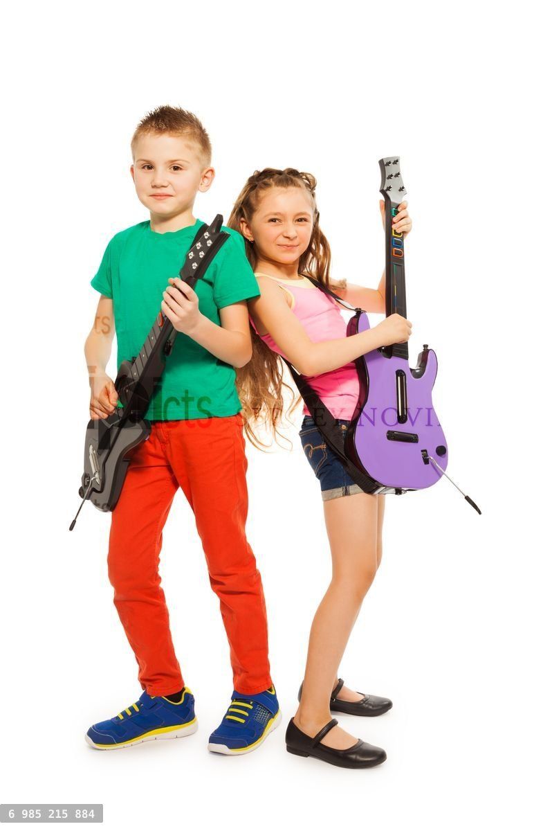 Girl and boy together playing on electro guitars