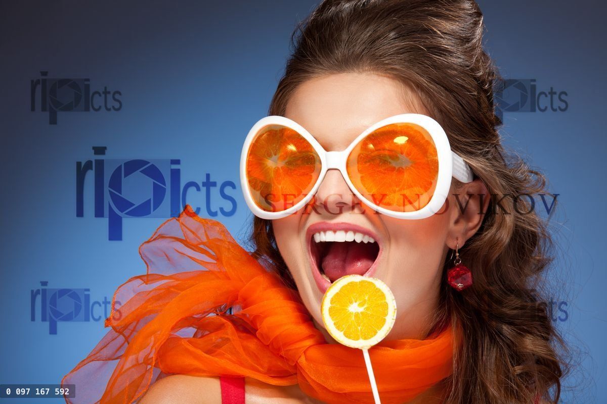 Woman with citrus lollipop