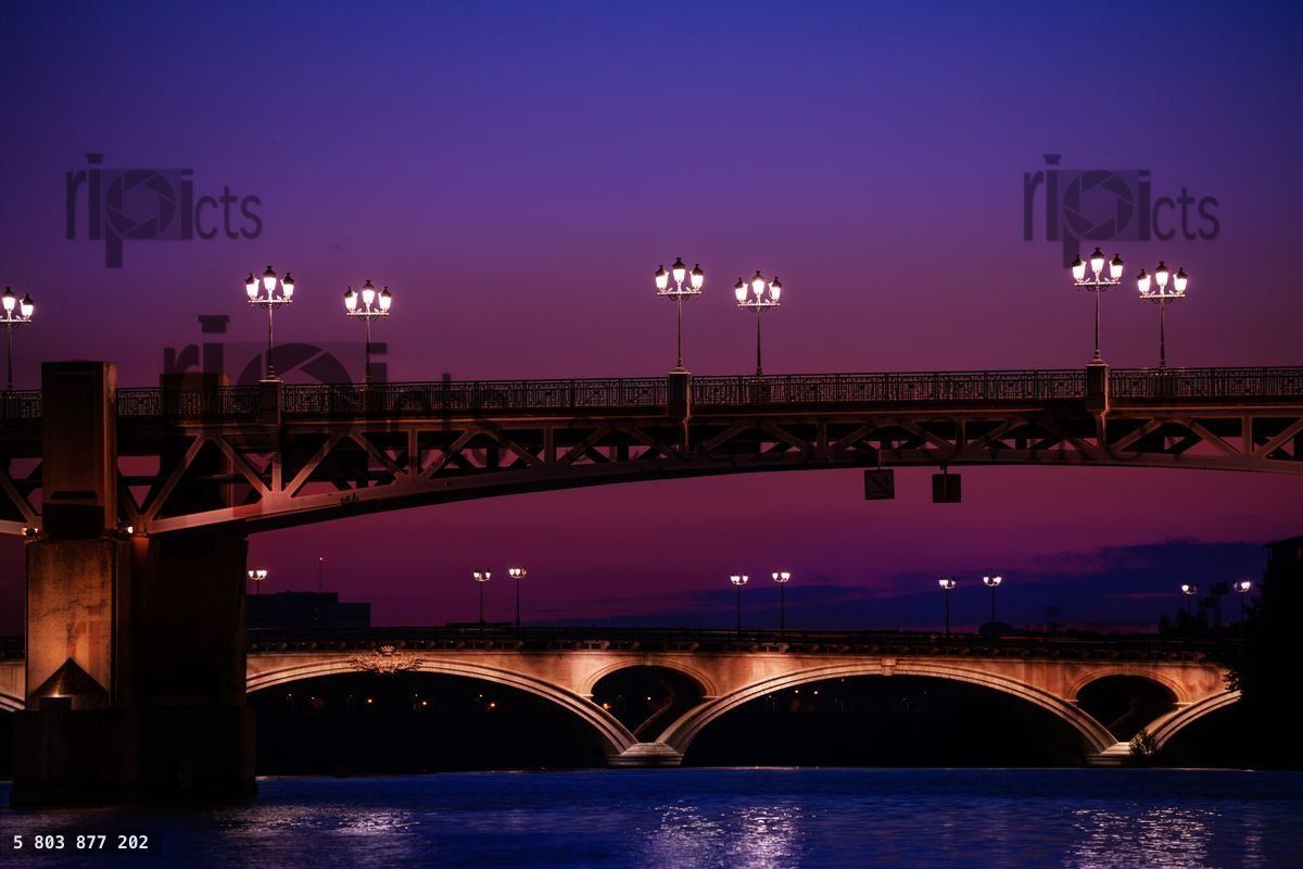 Garonne river with illuminated bridges at night
