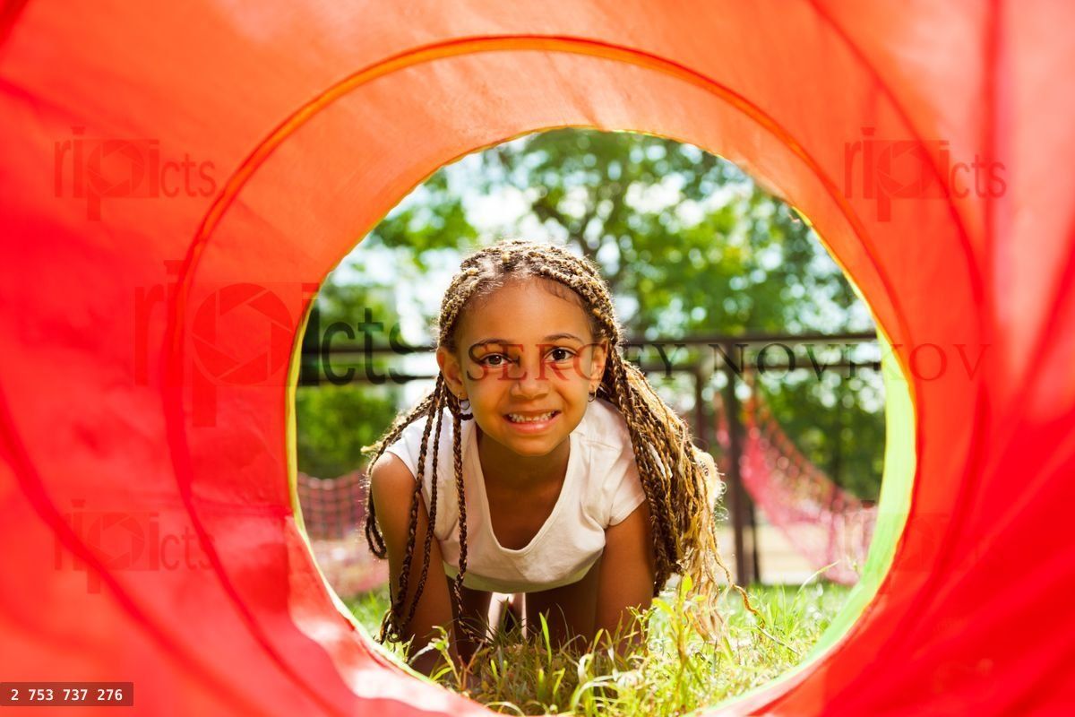 Black beautiful girl crawling though the tube