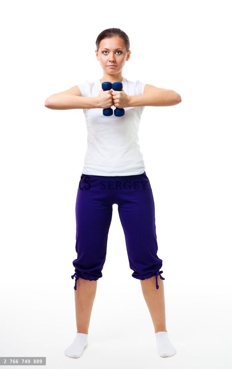 Woman stand with dumbbells