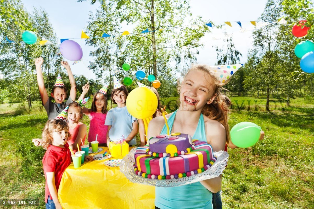 Happy birthday girl holding mastic icing cake
