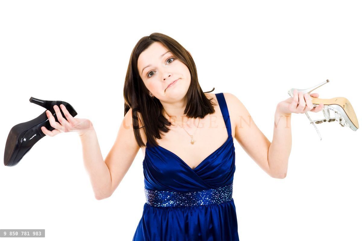 Woman holding shoes