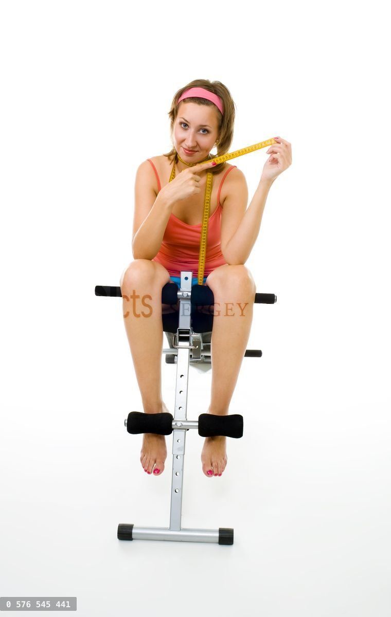 Woman with centimetre after fitness