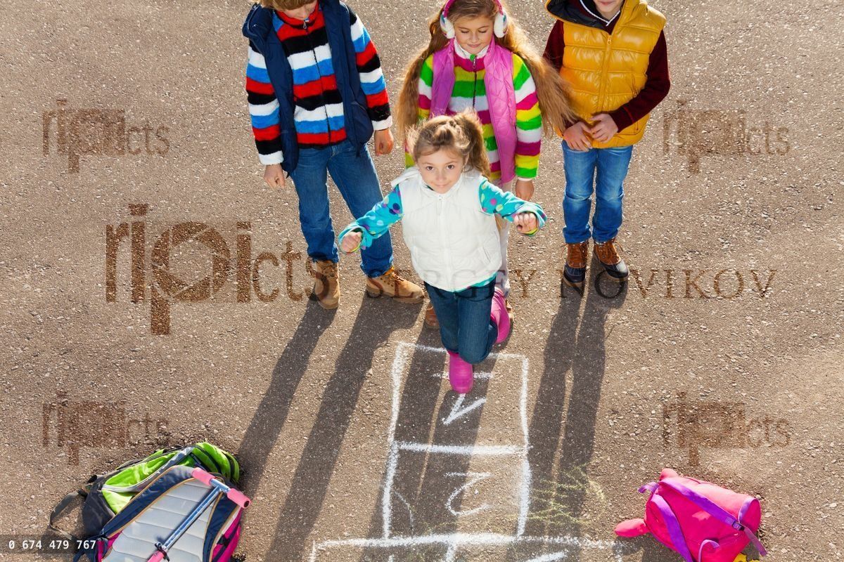 Friends play hopscotch