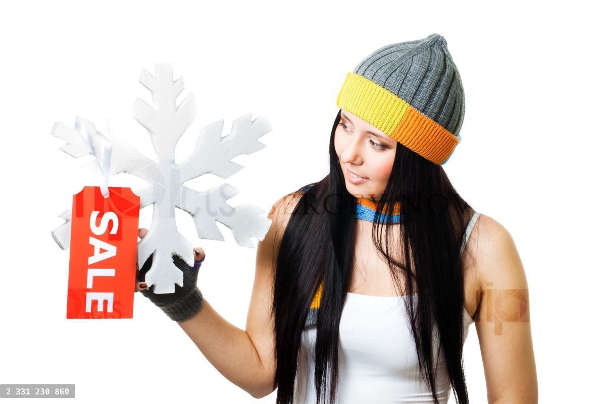 Woman hold snowflake with sale tag
