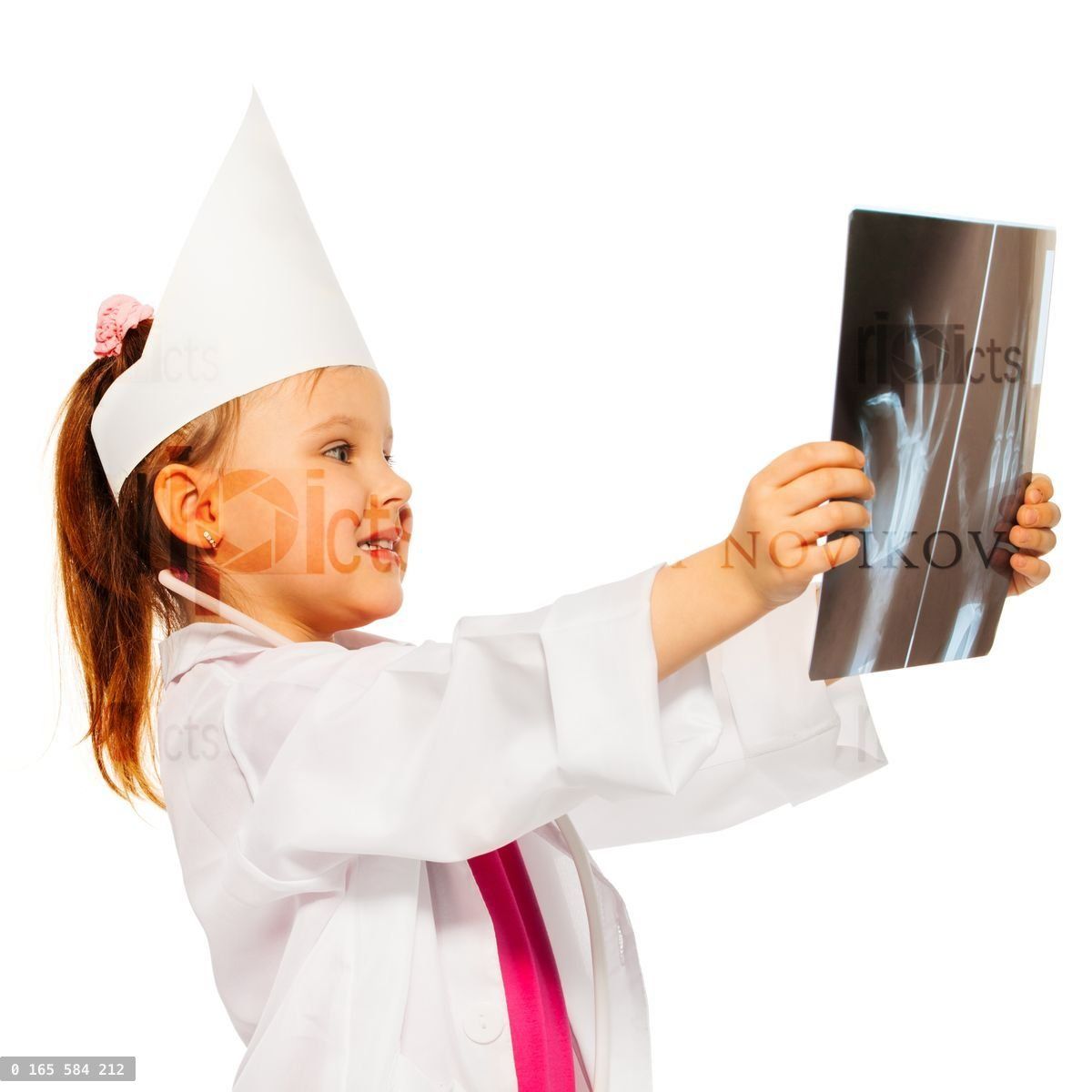 Young doctor radiologist studying an x ray