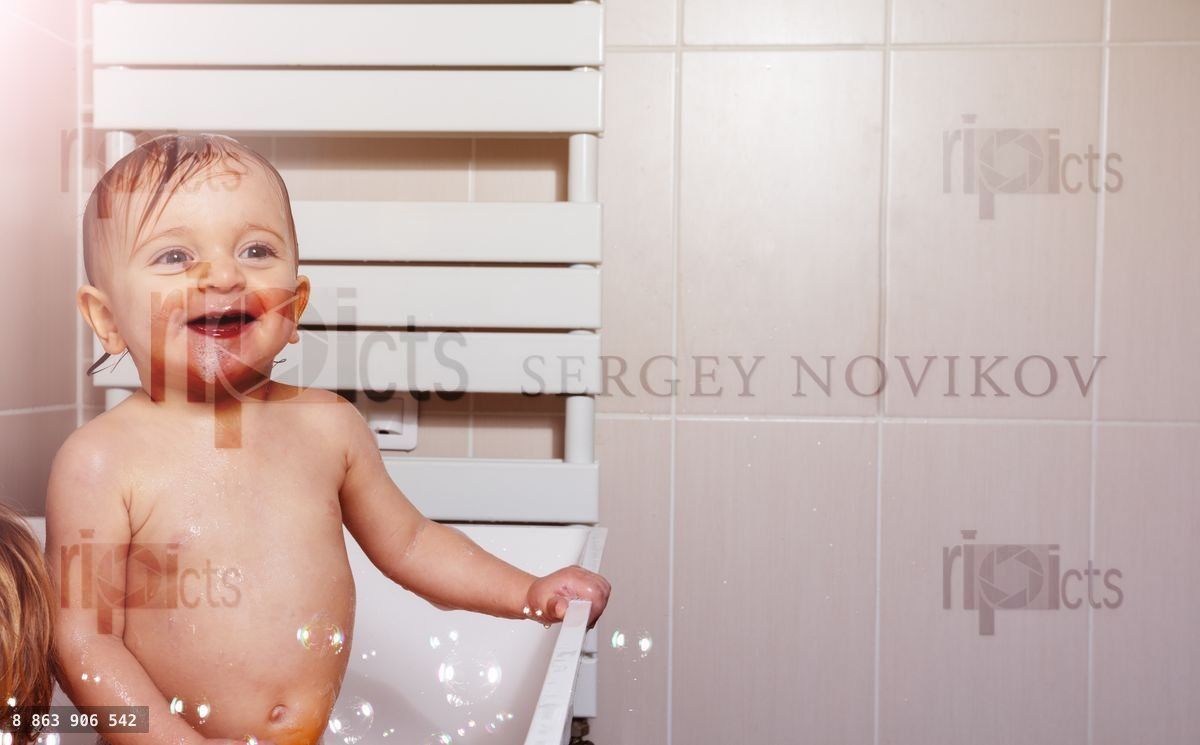 Fun time in bath little baby girl play with soap