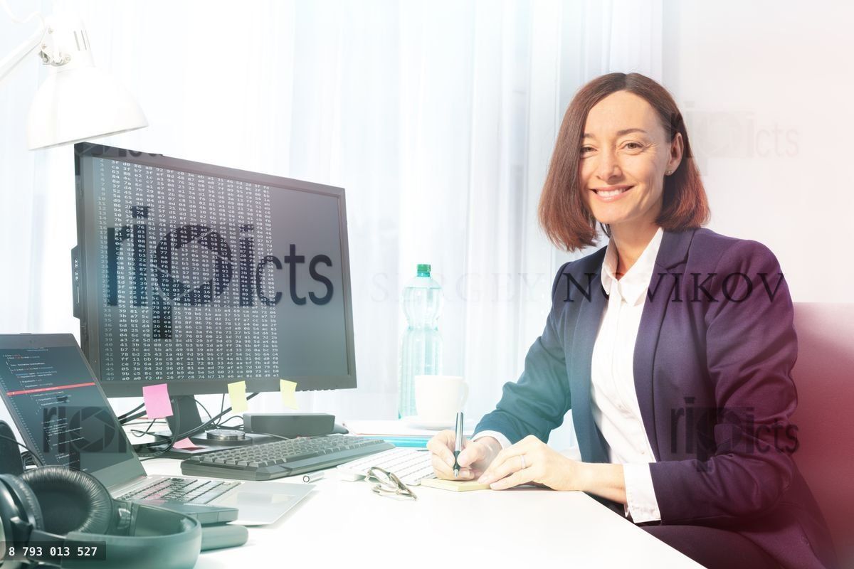 Businesswoman making notes with pen in the office