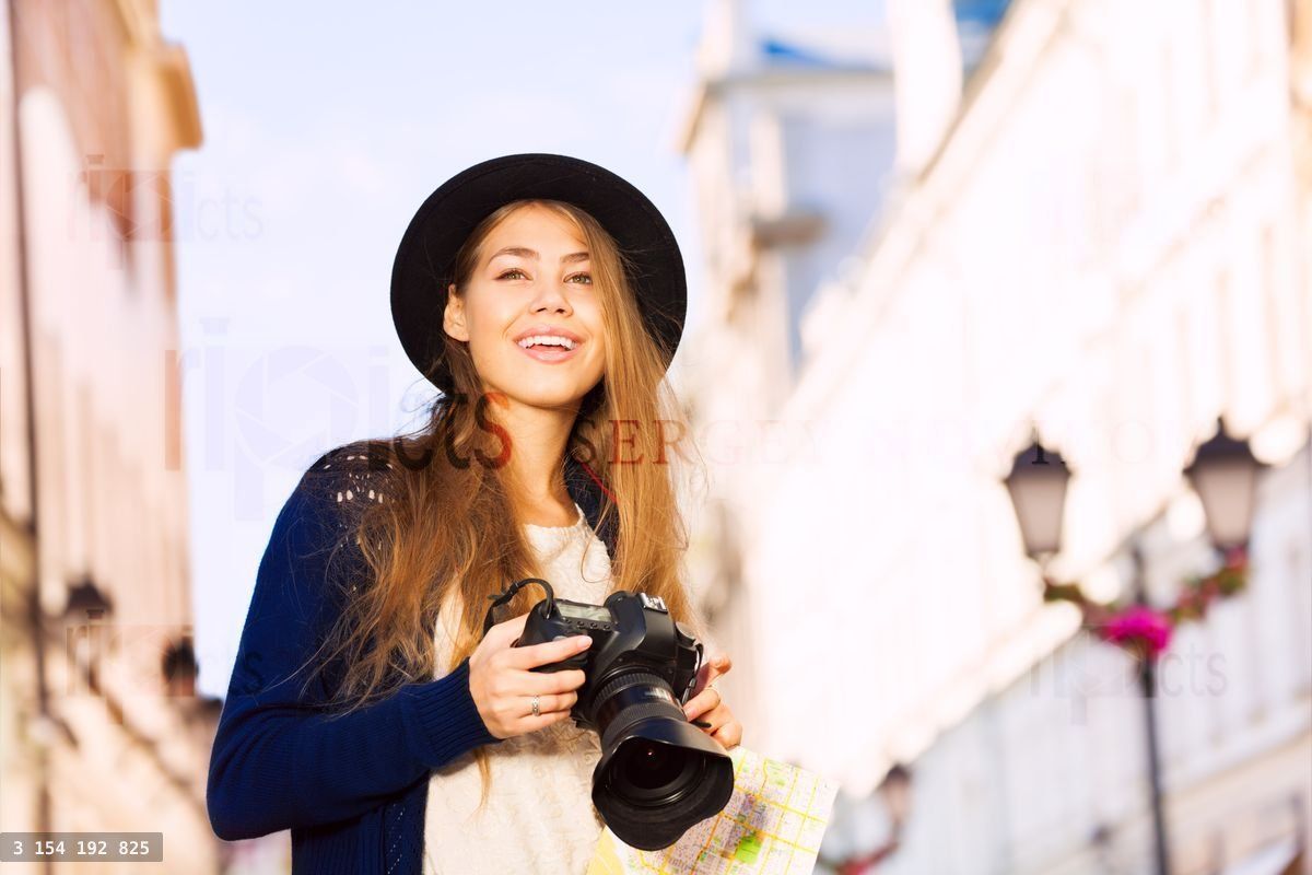 Portrait of woman in retro outfit with camera