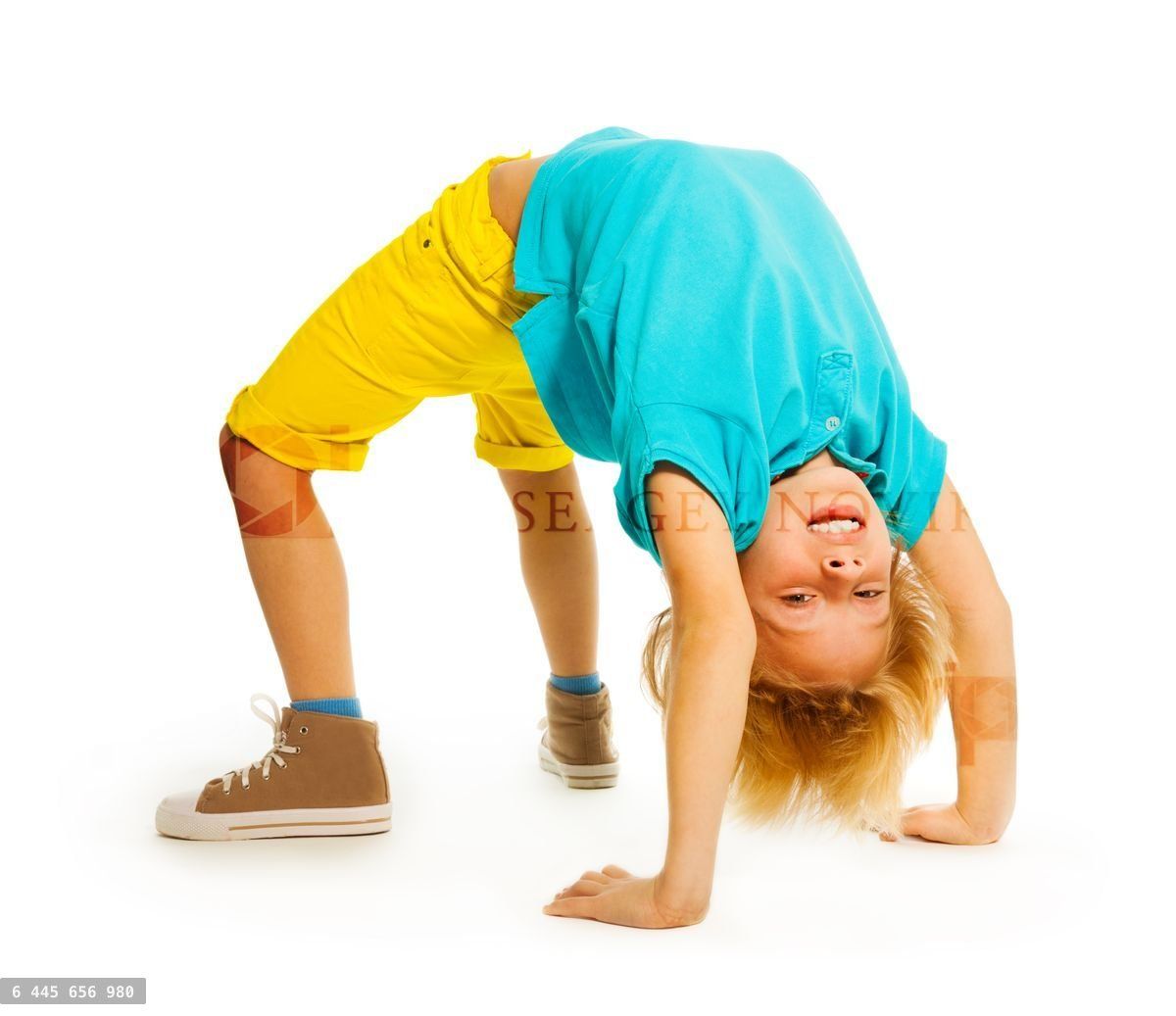 Happy boy showing acrobatic trick