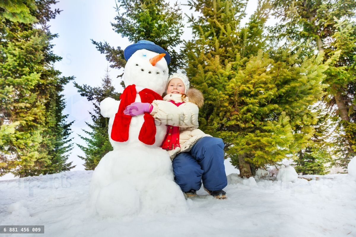 Girl and snowman with scarf together in forest