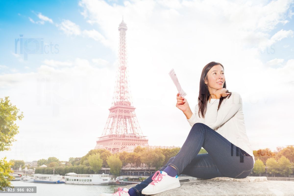 Woman looking for direction on street of Paris