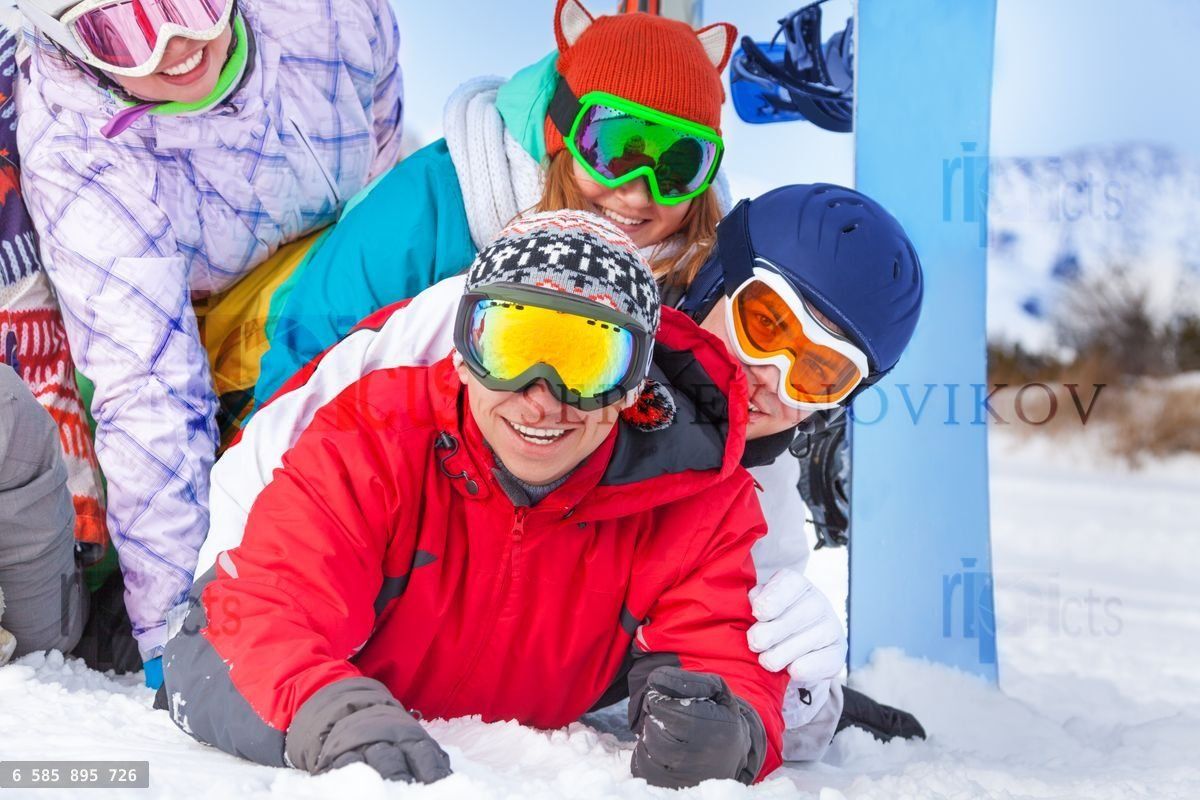 Young happy snowboarders portrait