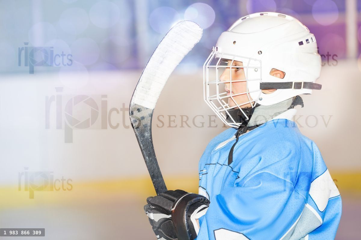 Young hockey player preparing to go out on rink