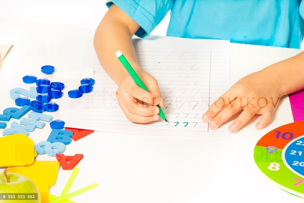 Fragment of kids hands holding mark pen writing