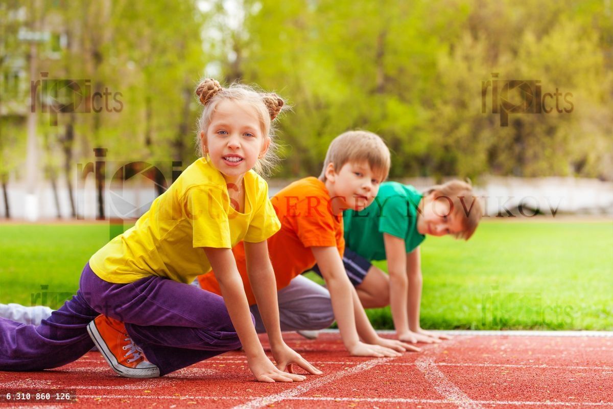 Children stand with bended knee ready to run