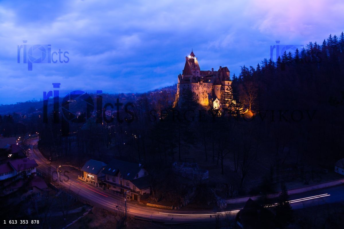 Bran Castle with lights at night in Romania