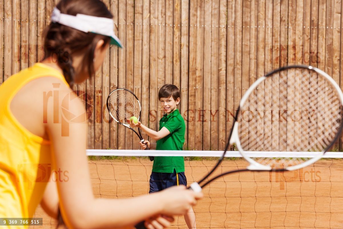 Boy holding tennis ball and racket, starting set