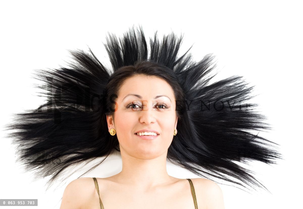 Woman with long black hair calm and smiling