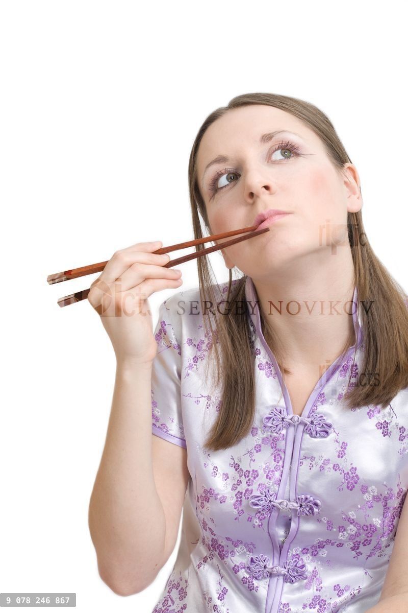 Woman with chopsticks for sushi