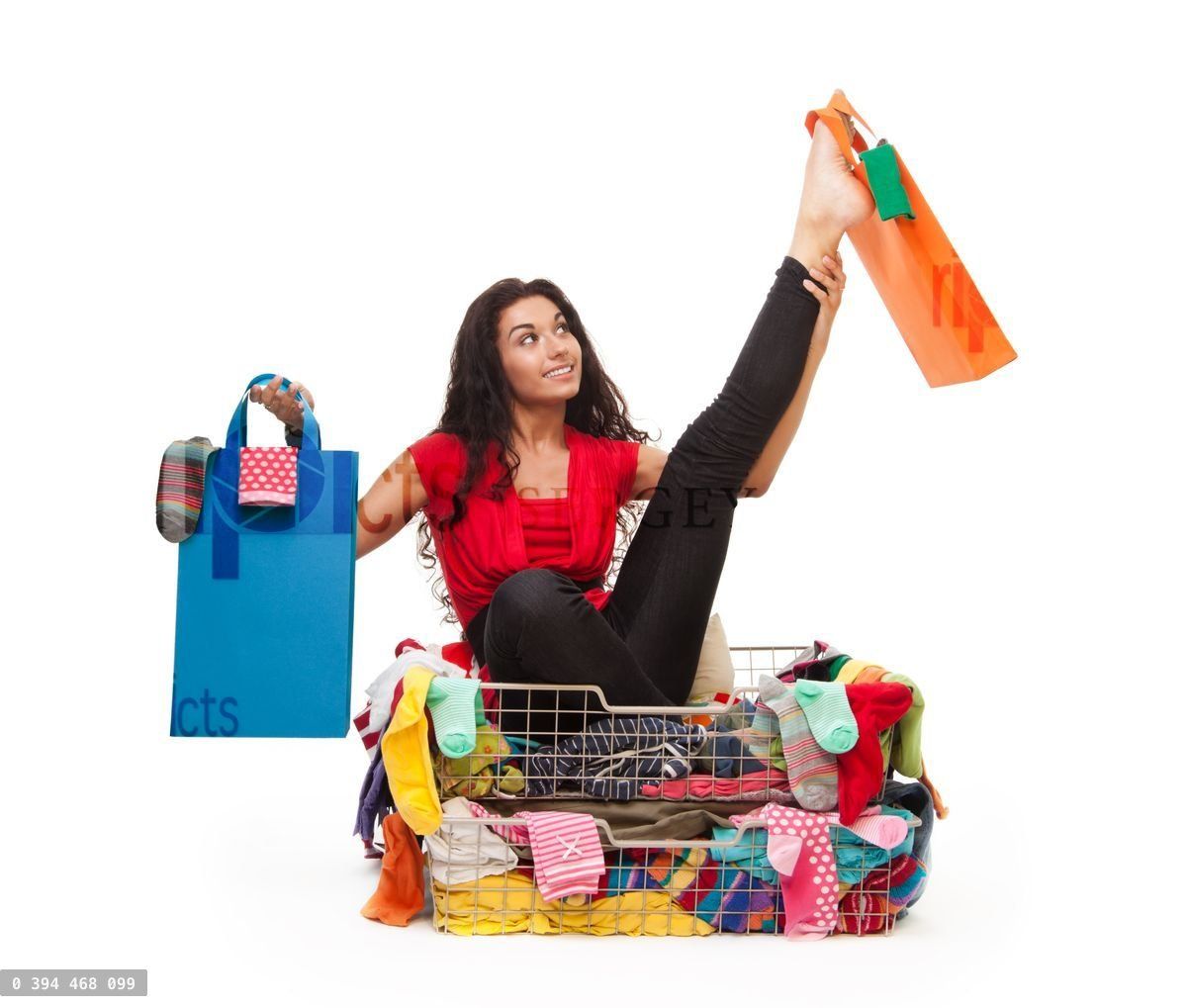 Woman in flexible pose with shopping bags